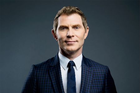 Bobby Flay in a black suit caught on the camera.